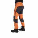 Nokko Orange outdoor trousers for men shown from the back on the model