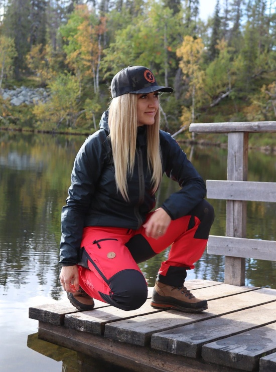 Red outdoor pants for women on model