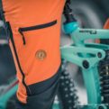 Nokko Orange men's outdoor trousers details thigh pocket and ventilation
